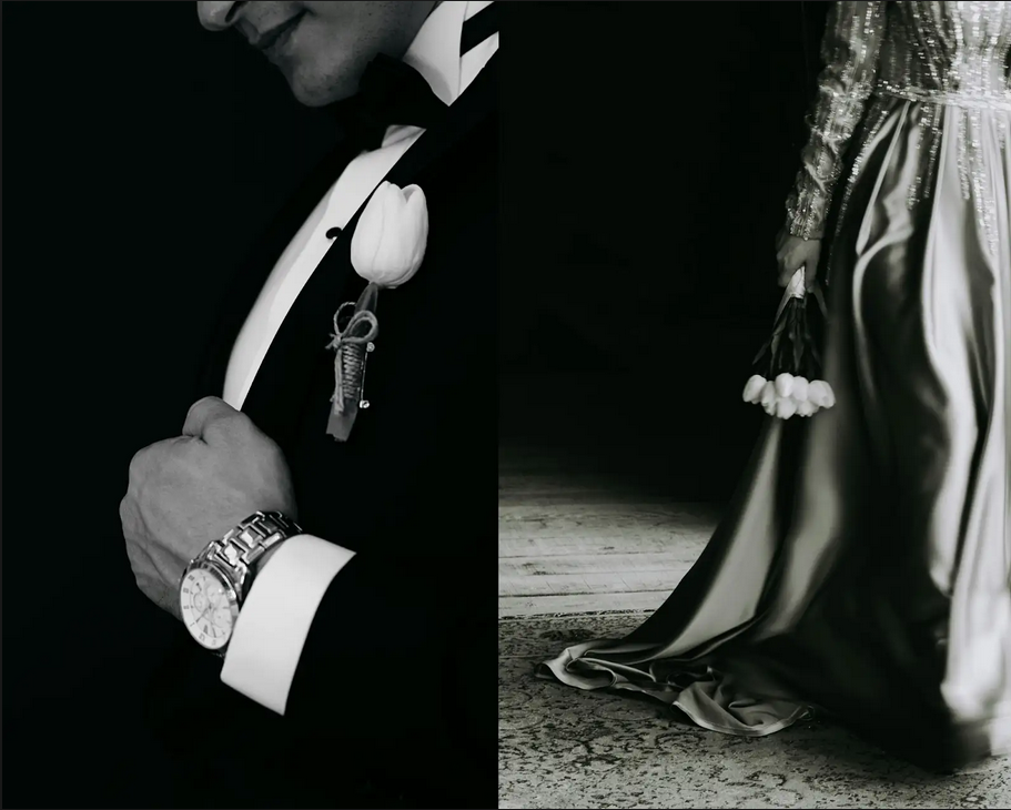 A man in a classic tuxedo stands beside a woman in an elegant gown, both exuding sophistication and style at a black-tie event