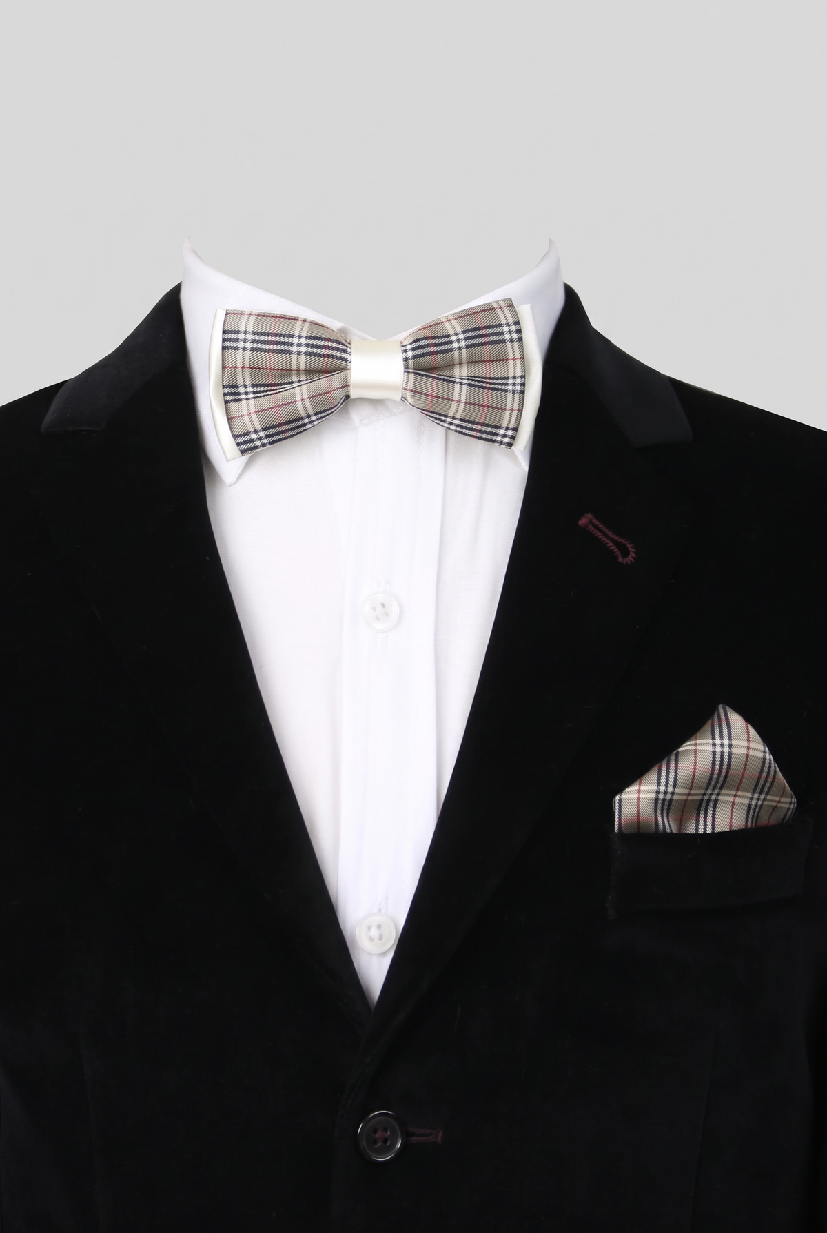 Boys checkered bow tie and matching pocket square styled with a formal suit in beige and black