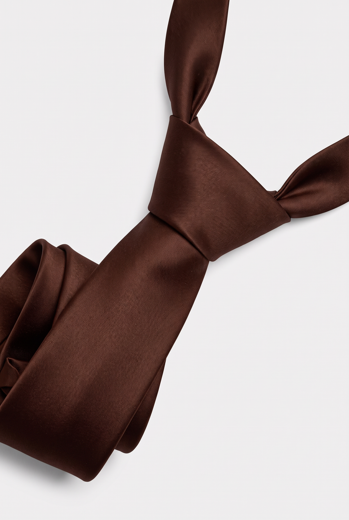 Brown satin necktie showing knot and fabric texture close-up