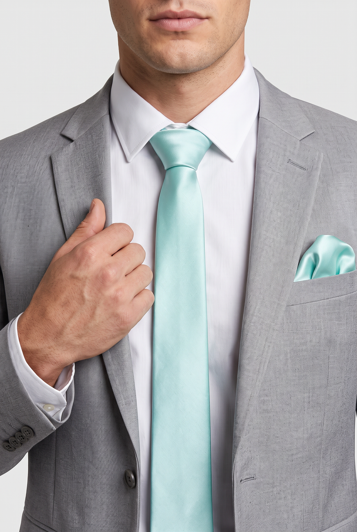 Mint satin tie and pocket square styled with a grey suit