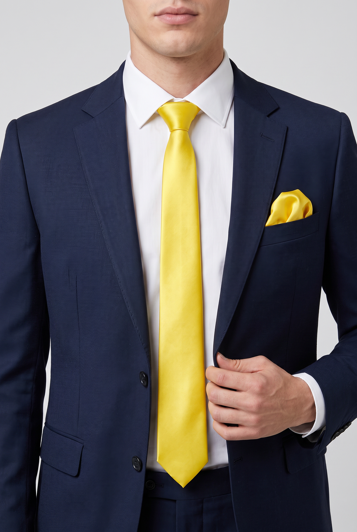 Yellow satin tie and pocket square styled with a navy suit