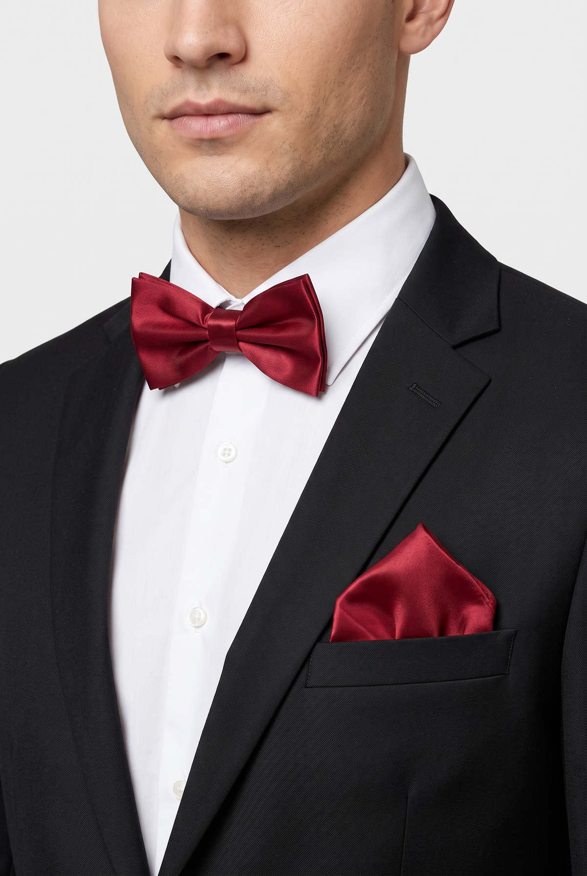 Men wearing a Burgundy satin bow tie and matching pocket square with a suit
