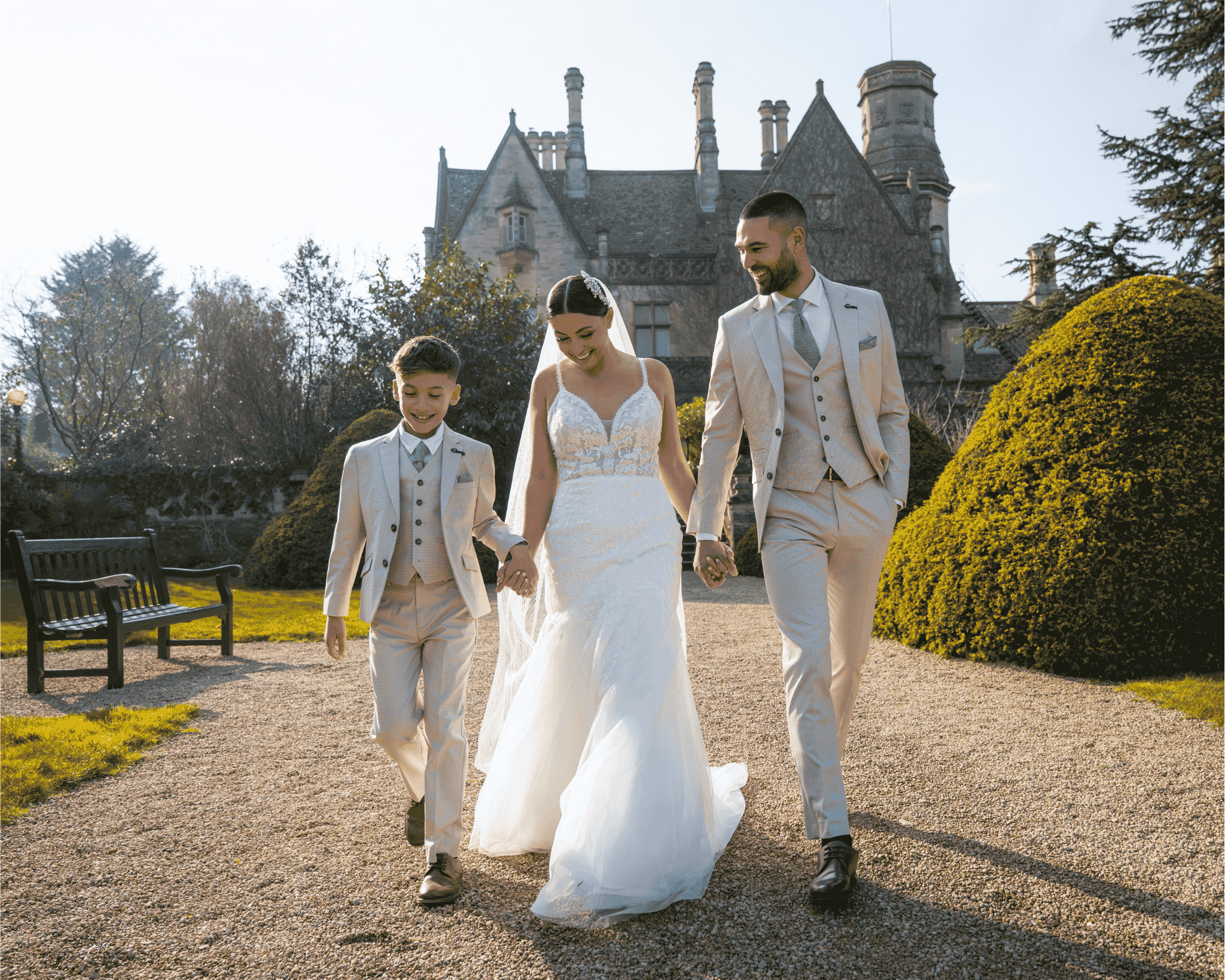 A family celebrating a summer wedding in coordinated formal suits and dresses.