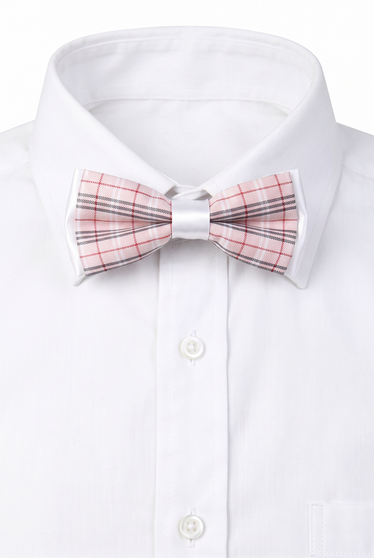 Boys checkered pre-tied bow tie worn with a white formal shirt in pink and red