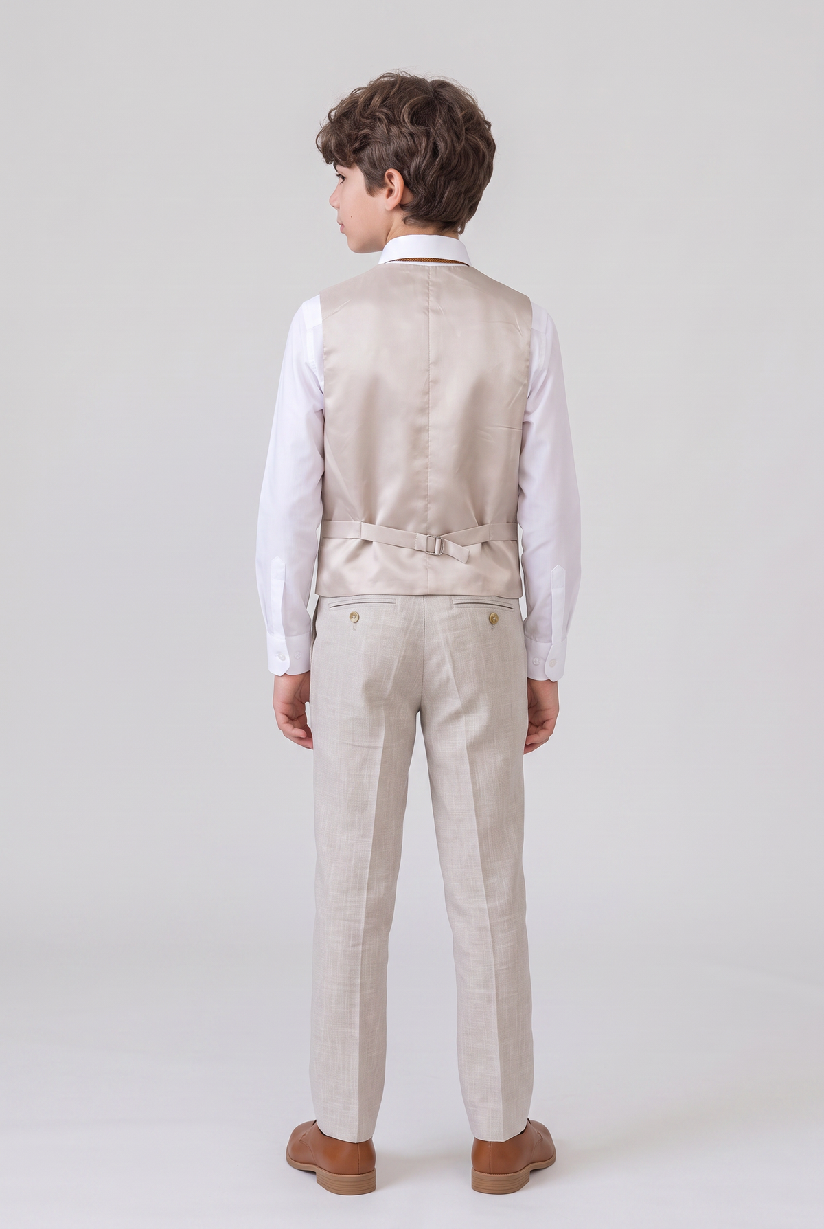 Back view of beige suit vest and trousers for boys