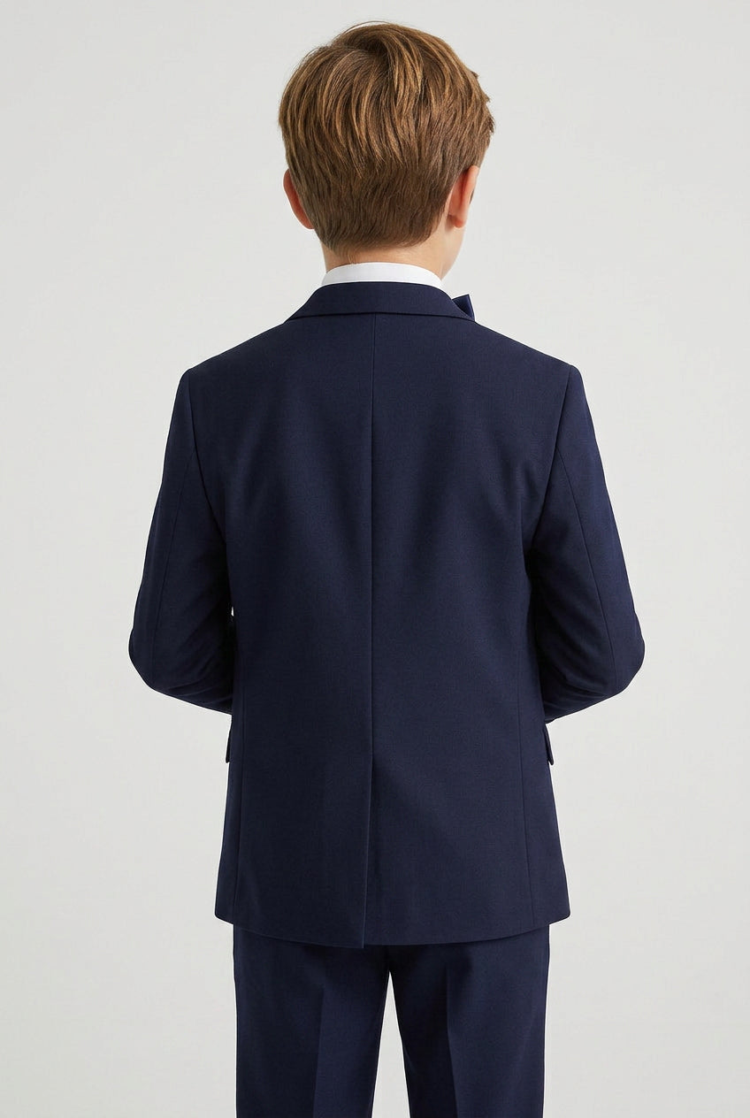 Boys navy tuxedo suit with matching navy lapel back view
