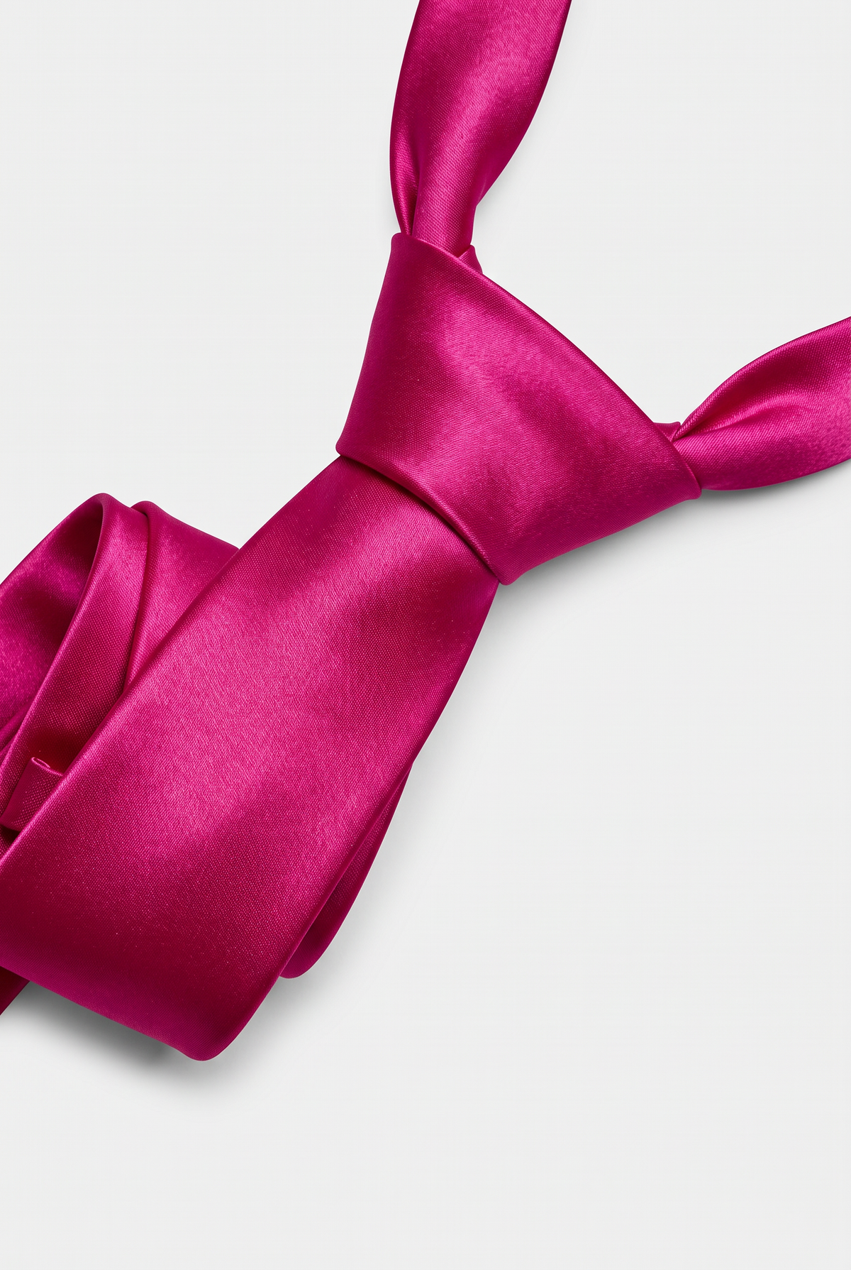 Fuchsia satin necktie showing knot and fabric texture close-up 