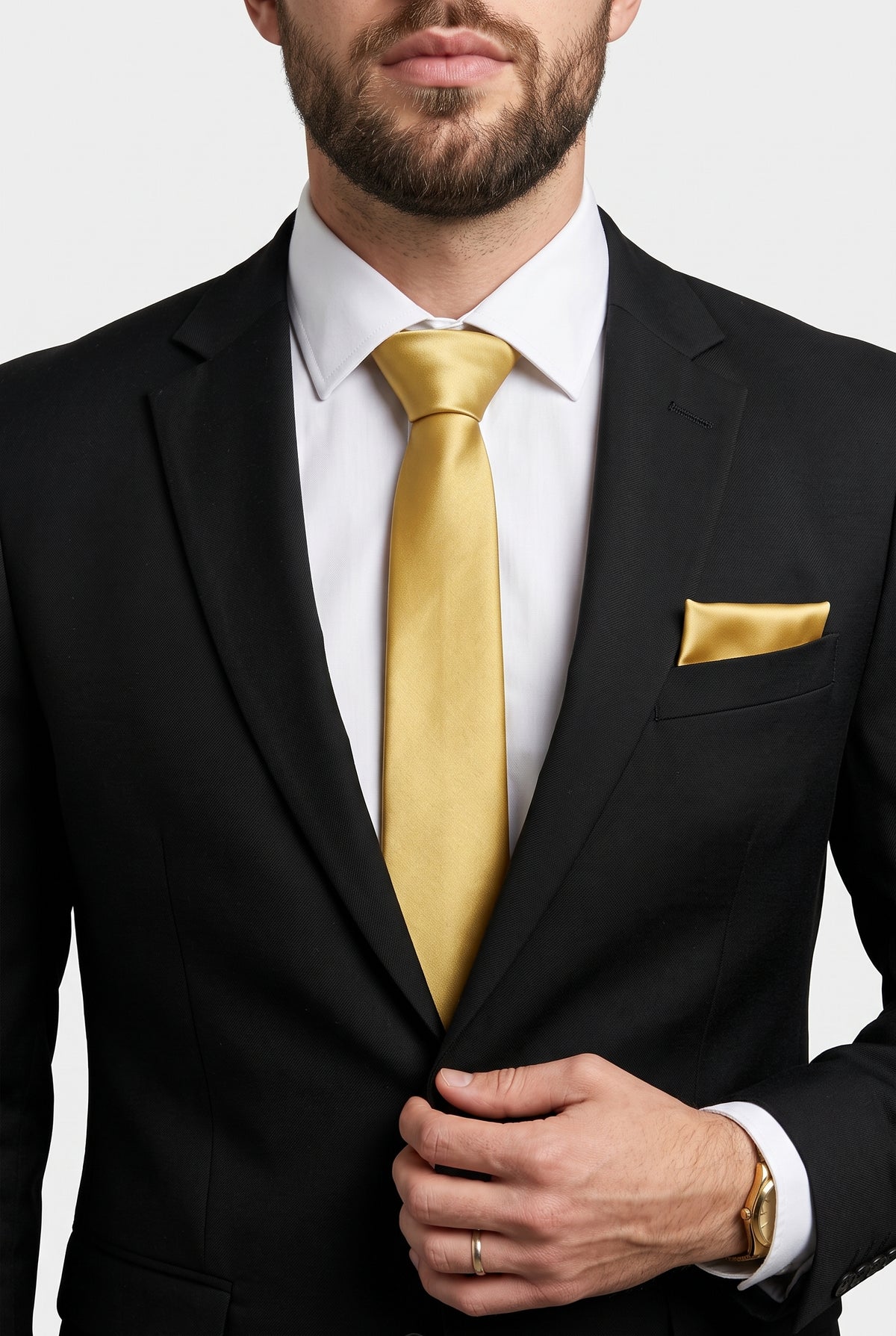 Gold satin tie and pocket square styled with a black suit