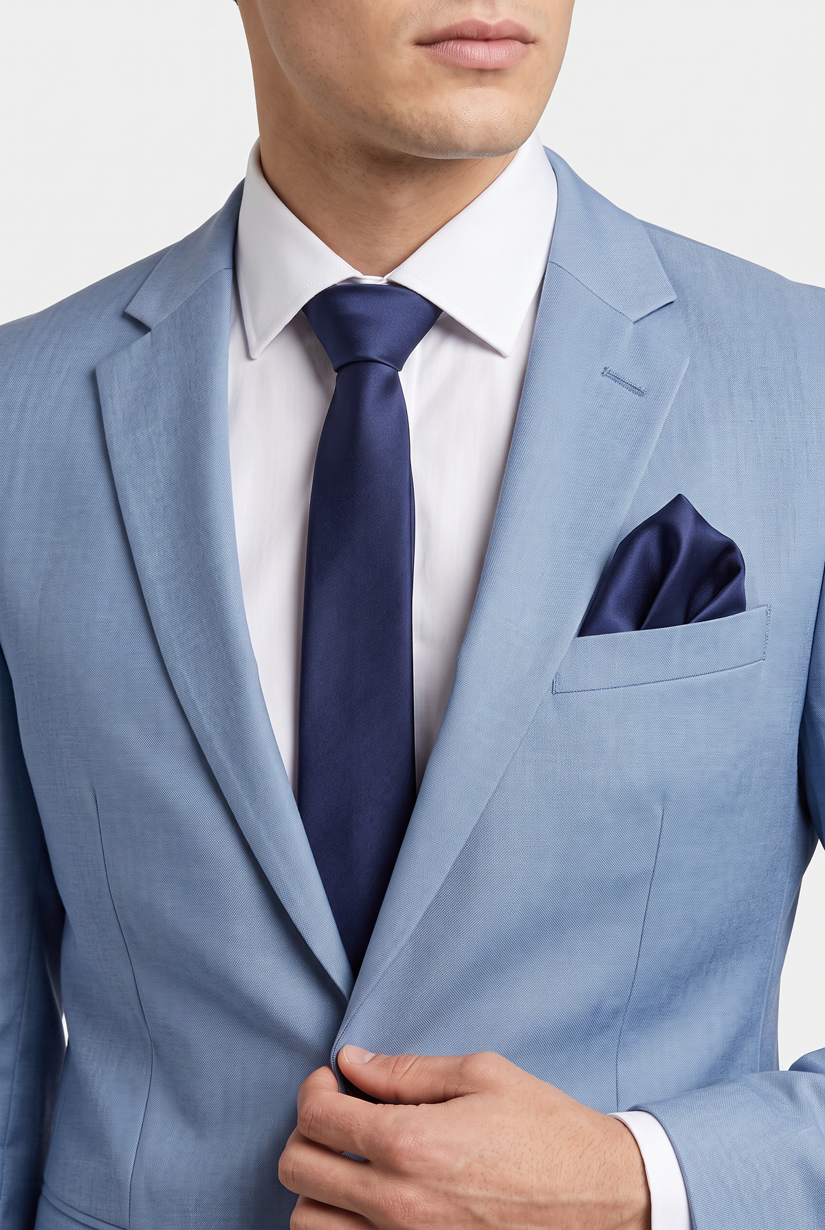 Navy satin tie and pocket square styled with a black suit