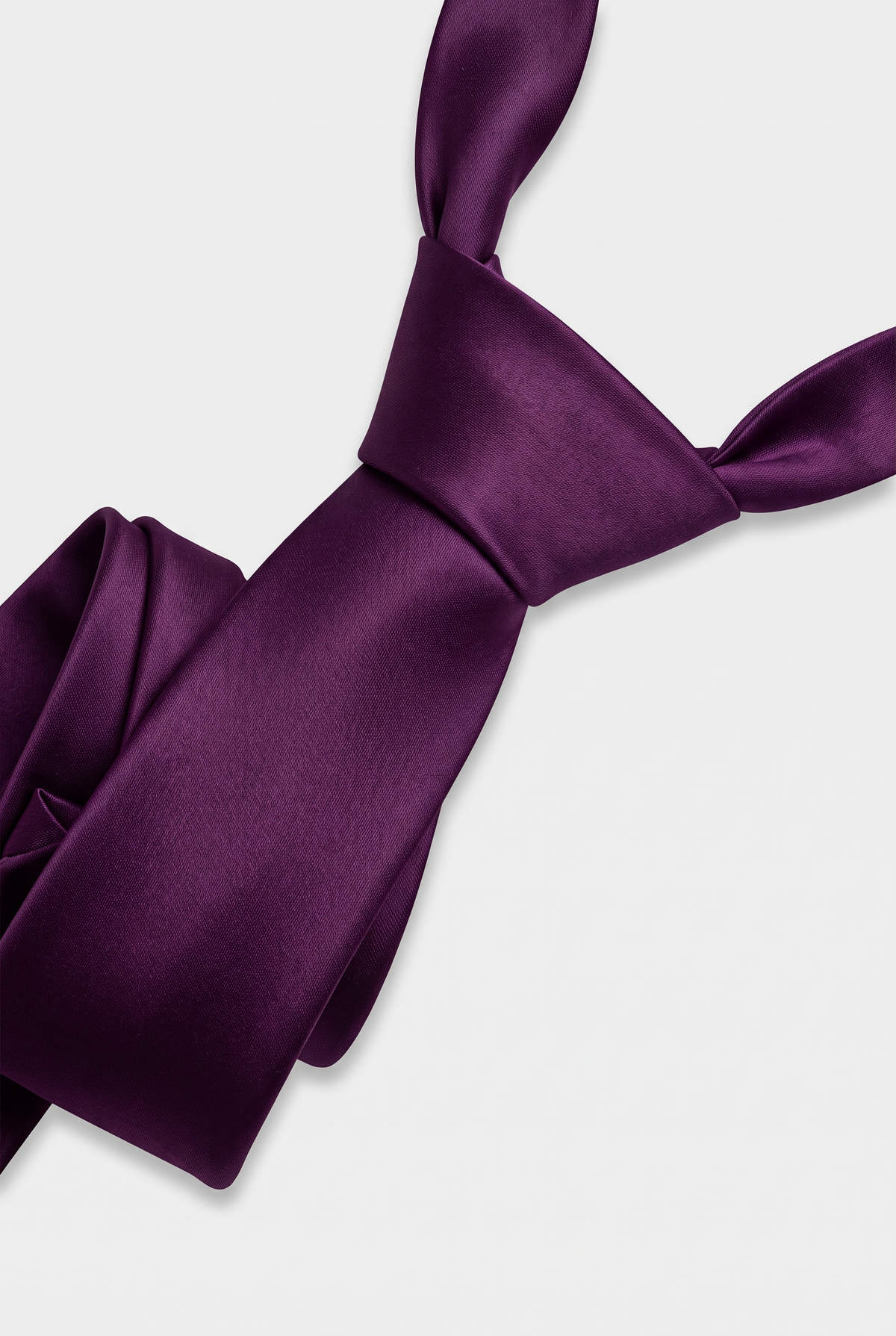 Purple satin necktie showing knot and fabric texture close-up 