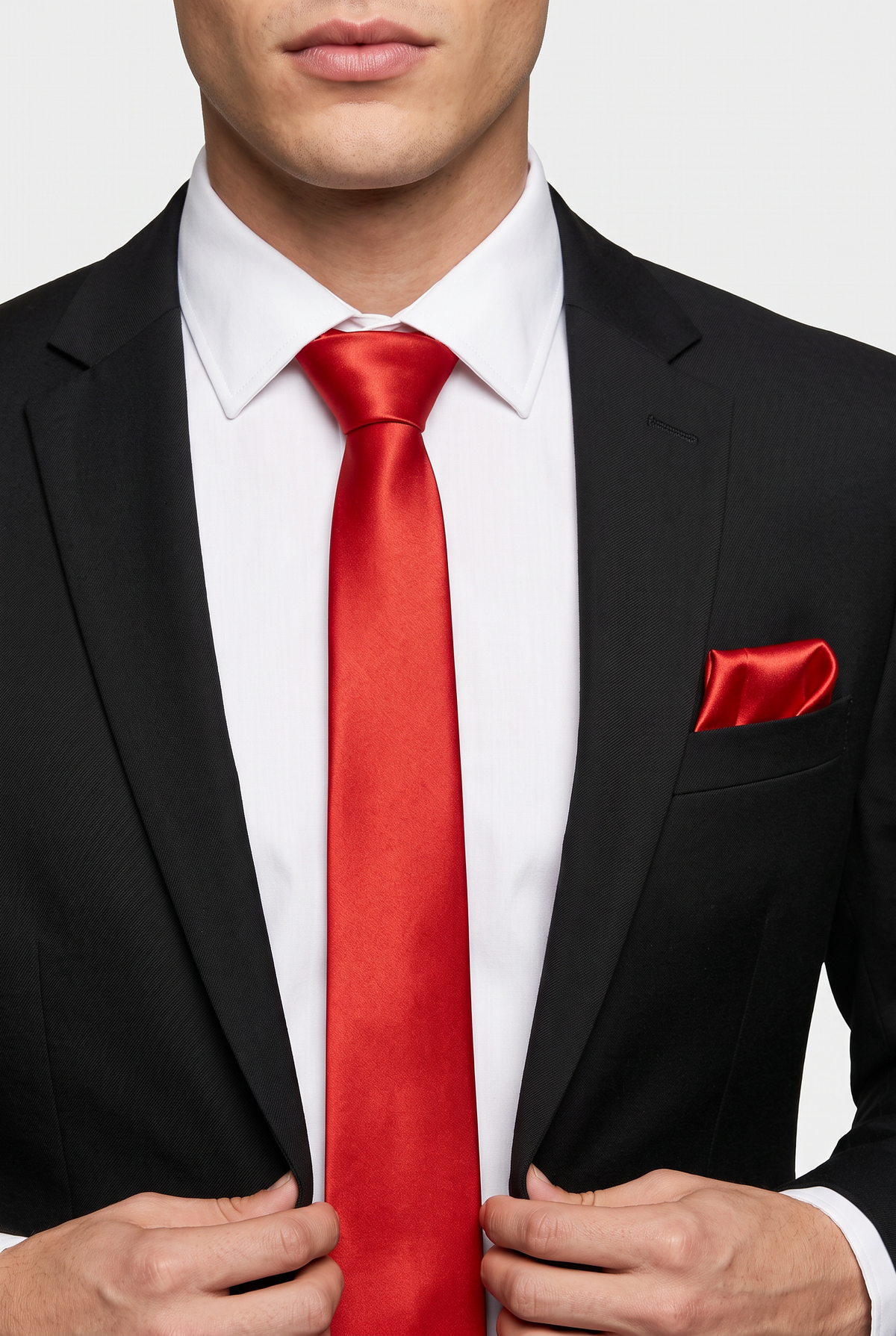 Red int satin tie and pocket square styled with a black suit